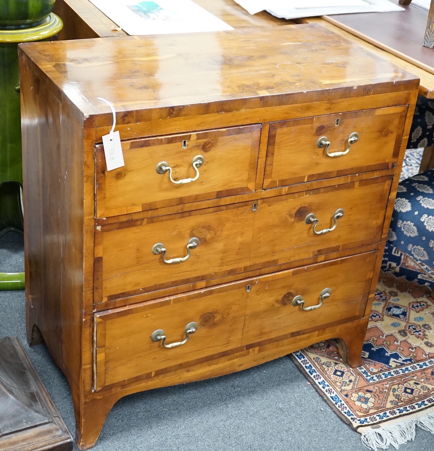 A modern Georgian style yew veneered chest, width 78cm *Please note the sale commences at 9am.